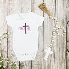 Introducing our "Created with a Purpose" baby short sleeve Bodysuit, designed with your little one's comfort and style in mind. Made from soft breathable cotton, this bodysuit provides gentle comfort for your baby's sensitive skin while allowing them to move freely.  Featuring a beautiful Christian inspired design, this bodysuit showcases the "Created with a Purpose motif, reminding you of God's divine plan. The envelope neckline and snap closure make dressing and diaper changes quick and easy, Fitted Short Sleeve Onesie With Custom Print, Customizable Short Sleeve Onesie For Summer, Fitted Short Sleeve Onesie With Name Print, Cotton Baptism Onesie With Short Sleeves, Personalized Fitted Short Sleeve Onesie, White Short Sleeve Onesie For Baptism, Personalized Fitted Short Sleeve Bodysuit, Customizable Fitted Short Sleeve Bodysuit, Fitted Cotton Bodysuit For Baptism