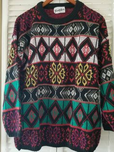 "Vintage  1980s light weight Touch Me Knits funky 80s colors sweater. The size tag has been removed, but trying it on tells me it's about a medium to large. The 80s sizes ran big. %100 soft acrylic,  this sweater has been loved to softness for being %100 acrylic . 22\" chest= pit to pit  27\" total length= top to bottom 18\" sleeve= shoulder seem to cuff bottom 6\" diameter  neck opening" Oversized Retro Acrylic Sweater, Retro Acrylic Sweater For Winter, Retro Acrylic Winter Sweater, Colorful Crew Neck Sweater For Winter, Retro Multicolor Knit Sweater, Oversized Multicolor Retro Sweater, Retro Multicolor Acrylic Sweater, Retro Multicolor Winter Sweater, Multicolor Retro Winter Sweater