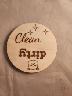 a wooden sign with the words clean and an image of a pig sitting on it