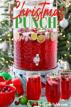 A large beverage container filled with red holiday punch made from fruit juices and garnished with thin lime slices, ice, and fresh cranberries in glasses nearby. Non Alcoholic Christmas Punch, Best Christmas Punch Recipe, Christmas Party Drinks, Frozen Limeade, Non Alcoholic Punch, Fresh Cranberry, Alcoholic Punch