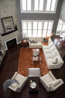 an aerial view of a living room with white furniture