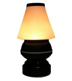 a black table lamp with a white shade on it's top and bottom part