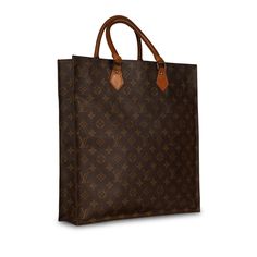 A bag that meets fashion and function, style and practicality, the Louis Vuitton Vintage Sac Plat PM is an absolute must-have for, well, anyone. Crafted in the brand's signature monogram canvas, the Sac Plat features two top handles, gold tone hardware and a rectangular, box-like silhouette. A versatile piece that can easily compliment any style of outfit, this LV gem is one you'll have in your wardrobe forever. A classic vintage piece that will remain timeless, the Sac Plat is a well-worthy investment and addition to any luxury handbag collection. SPL Exterior Monogram canvas Brown leather handles Gold tone hardware Open compartment Good vintage condition – darkening to leather trimmings, slight rubbing to corners, crease across bag Interior Beige leather lining Single compartment Louis V Louis Vuitton Vintage, Bag Interior, Handbag Collection, Dior Shoes, Vintage Louis Vuitton, Brown Canvas, Leather Handles, Exclusive Bag, Casual Backpack