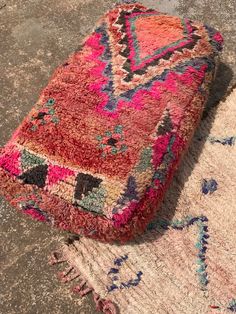 an old rug is laying on the ground