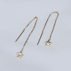 14K Gold Tiny Star Threader Earrings The earrings are 14K gold 14k gold tiny star charm is about 6mm The earrings will be shipped in a nice gift box. To see add-on click on the link below. https://www.etsy.com/shop/SashJewelry?section_id=12359884 To see more children's jewelry click on the link below. http://www.etsy.com/shop/SashJewelry?section_id=12441132 To see more Sash Jewelry items click on the link below. http://www.etsy.com/shop/SashJewelry Please don't hesitate to contact me for custom Yellow Gold Star Earrings For Everyday, Everyday Star-shaped Yellow Gold Earrings, Everyday Yellow Gold Star Earrings, Everyday Yellow Gold Earrings With Star Charm, Dainty Yellow Gold Star Earrings, Minimalist Yellow Gold Jewelry With Star Charm, Minimalist Yellow Gold Star Earrings, Yellow Gold Star Charm Dangle Jewelry, 14k Gold-filled Yellow Gold Star Charm Jewelry