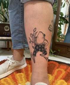 a person with a tattoo on their leg