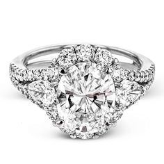 a diamond ring with three stone halos