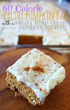 a close up of a piece of cake on a wooden table with the words healthy pumpkin bars