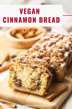 vegan cinnamon bread on a cutting board with cinnamon sticks and cinnamons in the background