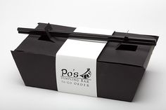 a black and white box that has some stickers on the side of it to say po's morning bar