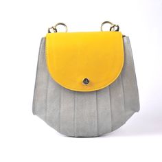 "This  Designer Genuine Leather Handbag Bag, Handmade Leather Bag, Handbag, Woman Leather Bag, Elegant Leather Bag, Shoulder Purse For Women. This leather is genuine and durable with little care it will last for years. You can keep the leather in good form by using leather balm. Item Description: *Material: Genuine leather *Dimensions: 3.5X10x9.50\" inches Bag *Compartment: 2 *Closure Type: Zipper *Handle: 13\" Inches  *Color options: Yellow & Gray (other colors available on request) *Care Instr Yellow Flap Bag With Adjustable Strap For Everyday Use, Yellow Shoulder Flap Bag For Everyday Use, Yellow Satchel Flap Bag For Everyday Use, Yellow Leather Mobile Phone Bag, Everyday Yellow Satchel Flap Bag, Yellow Leather Satchel With Mobile Phone Bag, Handmade Everyday Standard Backpack, Yellow Rectangular Leather Backpack For Everyday Use, Yellow Leather Flap Bag For Everyday Use