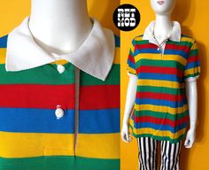 "Bright Vintage 70s Colorful Stripe Polo Shirt by Young Stuff I believe this is NWOT (new without tags)! Feels really crisp and fresh. Please note that colors can vary from screen to screen, and in real life. Photos make the colors seem muddy, but its actually bright in real life. Has stretch. Shoulder 16\" (laid flat) Bust 22.5-25\" (laid flat) Length, Top to Bottom 26\" Bottom Opening 23\" (laid flat) Sleeve Length 8\" Sleeve Opening 5-9\" (laid flat)  Tag: Young Stuff / Size 40 Condition: 2 ( Retro Spring Top With Rainbow Print, Retro Rainbow Print Top For Spring, Retro Multicolor Tops With Rainbow Print, Retro Multicolor Rainbow Print Top, Retro Multicolor Collared T-shirt, Retro Collared T-shirt For Spring, Multicolor Collared Top With Retro Print, Retro Rainbow Tops For Summer, Retro Rainbow Tops For Spring