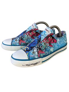 Be part of the fusion of vintage cool Ed Hardy & Christian Audigier low top sneakers - an iconic combination of art, design flair and tattoo artist style. More than just a shoe, it's a bold fashion statement that fuses streetwear and avant-garde aesthetics. Created by a renowned designer, these summer sneakers are a nod to the era-defining tattoo art. The vibrant designs and intricate details showcase a spirit of rebellion and individuality, making them the perfect gift for tattoo artists and an Ed Hardy Sneakers, Tattoo Artist Style, Ed Hardy Designs, Don Ed Hardy, Laceless Sneakers, Vintage Ed Hardy, Vintage Sneakers, Christian Audigier, Summer Sneakers