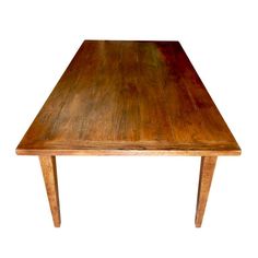 an old wooden table with no one sitting at the top or standing in front of it