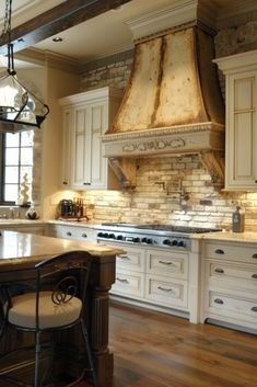 a large kitchen with an island in the middle and two ovens on each side