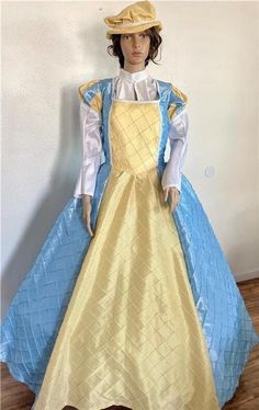 This listing is for a one piece Elizabethan, Renaissance, Medieval, Romeo & Juliet dress/gown and hat, your custom size choice of busts 30" to 44". The dress is made of a mix of light blue and yellow pintuck taffeta with the lower straight sleeves being made of white taffeta.  There is white gimp trim throughout.  And the flat hat is made of matching yellow pintuck taffeta with the same trim and a small brim.  The  bodice and upper sleeves are fully lined, and the dress laces down the back with Fitted Yellow Dress For Costume Party, Yellow Fitted Dress For Costume Party, Yellow Fitted Dress For Fancy Dress, Yellow Fitted Fancy Dress, Yellow Fitted Dress For Formal Occasions, Blue Princess Gown For Costume Party, Princess Style Fitted Dresses For Themed Events, Fitted Yellow Ball Gown, Yellow Fitted Ball Gown