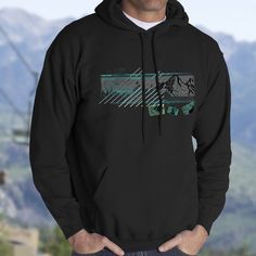 Mountain design for your beach goer or snowboader. Pullover over hoodie with soft fleece. Perfect hoodie for you outdoor surfer or snowboader. Nice pile jacket for that crisp hike in the woods. Cool Ocean Pacific vibe for the retro vintage look. Great gift for your cool hubby who used to board or surf. Stay cozy my friends Everyone needs a cozy go-to hoodie to curl up in, so go for one that's soft, smooth, and stylish. It's the perfect choice for cooler evenings! * 50% cotton, 50% polyester  * D Fade Designs, Mountain Designs, Outdoor Fashion, Soft Hoodie, Retro Vintage Style, Graphic Tops, Mom Tees, Fishing Shirts, Holiday Shirts