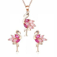 Bring a splash of playful elegance to your ensemble with the Pink Flamingo Bird Necklace and Earrings Set from the Ginger Lyne Collection. This delightful set embodies the whimsical charm of the flamingo, beautifully crafted in sterling silver and adorned with two-tone pink cubic zirconia that captures the essence of these enchanting birds. The set includes a pendant measuring 34mm (approximately 1.34 inches) and matching earrings that are 17mm (approximately 0.67 inches) in length. Each piece i Pink Flamingos Birds, Bird Shape, Vacation Jewelry, Flamingo Earrings, Flamingo Bird, Womens Earrings Studs, Bird Necklace, Bird Pendant, Women's Jewelry Sets