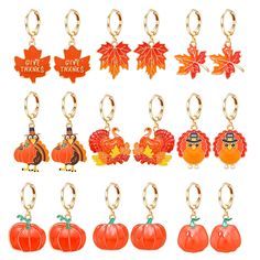 a bunch of pumpkins and turkey key chains with thanksgiving decorations on them, all in different colors