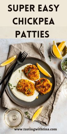 chicken patties on a plate with lemon wedges