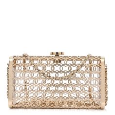 This is an authentic CHANEL Metal CC Moucharabieh Minaudiere Crossbody in Gold. This stunning piece is crafted of gold metal with a leather threaded gold chain shoulder strap and Chanel CC closure hardware. Elegant Gold-tone Chain Link Jewelry With Logo Plaque, Elegant Gold-tone Chain Link Jewelry, Elegant Evening Jewelry With Gold Clasp, Yellow Gold Jewelry With Chain Strap For Evening, Designer Formal Jewelry With Chain Strap, Glamorous Gold Jewelry For Events, Luxury Jewelry For Events, Glamorous Gold Jewelry For Gala, Chic Gold-tone Evening Jewelry