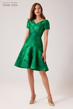 Make a bright statement in our mikado flounce skirt dress, designed to make you feel extraordinary. The v-neckline, short sleeves, and knee length cut strikes a balance between formal and casual, allowing you to dress it up or down as per your preference. The emerald green hue will make you the center of attention wherever you go, and the modern design is both comfortable and versatile, making it suitable for a wide range of occasions. Whether you’re headed to a cocktail party, garden party, or Knee Length Cocktail Dress, Flounce Skirt, Cocktail Party, Garden Party, Knee Length, Dress Skirt, Modern Design, Short Sleeves