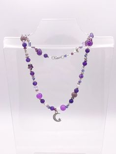 This is a galaxy inspired necklace featuring intricate purple beads and a moon & stars charm. Diy Glow, Galaxy Necklace, Purple Star, Purple Beads, Inspired Necklace, Moon Stars, Star Charms, Star Necklace, Stars And Moon