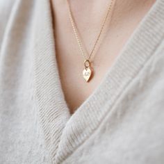 This Classic Heart Charm can be worn in so many different ways: on its own, short or long, clustered with other collected pieces, or on a bracelet. It's such a simple and beautiful piece, you really can't go wrong! It was designed with intention. The nice, thick piece of gold allows for a weighty feel. Its jump ring and bail are fixed together, making it sturdy and more visually appealing. Lastly, it's intentionally a blank slate - beautiful on its own and with so many options to customize it - engraving special names or dates, adding diamonds, sapphires, or rubies.. the list goes on! Heart Initial Necklace, Sweet Necklace, Alternative Metal, Tell Your Story, 14k Gold Necklace, Hand Engraving, Jump Rings, Initial Necklace, Cable Chain