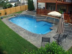 an above ground pool surrounded by lawn chairs and umbrellas