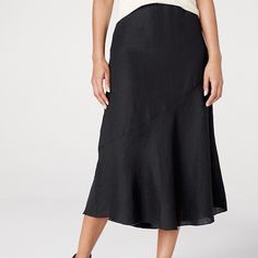 This Black Midi Skirt Is Well Suited For The Season, With The Fine Texture And Barely There Feel Of Handkerchief-Weight Organic Linen Woven From Flax Grown In France. All Kinds Of Flattering, With A Diagonal Bias Seam That Encourages It To Flare Softly And Sweetly At The Hem. By Eileen Fisher Relaxed Fit A-Line Silhouette Elastic Waist With Side Zip And Internal Security Button Midi Length 100% Organic Linen Waist - 38"+, Length - 33 Elegant Black Flowy Wrap Skirt, Chic Black Flowy Wrap Skirt, Black Tiered Wrap Skirt With Lining, Chic Black Tiered Wrap Skirt, Black Tiered Lined Wrap Skirt, Flowy Black Wrap Skirt With Lining, Black Tiered Wrap Skirt In Relaxed Fit, Black Flowy Lined Wrap Skirt, Chic Black Wrap Skirt