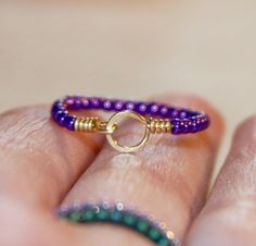 A cute dark purple beaded stackable thin ring made from 14k gold filled wire. Each band is strung with delicate seed beads and wire wrapped by me. The delicate circle is handmade by me and wire wrapped for a beautiful finished look. An excellent gift for your bridesmaids, flower girl, or yourself. A ring for everyday made in the following US Ring Sizes: 2 - 13. Beaded Circle, Wire Wrapped Jewelry Pendant, Wire Jewelry Rings, Diy Beaded Rings, Making Bracelets With Beads, Diy Jewelry Rings, Wrapped Rings, Ring Purple, Purple Beaded