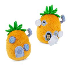 two stuffed pineapples with eyes and ears are shown in front of each other