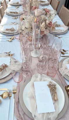 the table is set with plates, silverware and napkins for dinner guests to enjoy