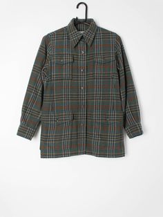 Womens vintage Saint Laurent plaid flannel shirt. Pure wool, made in France circa 1970. Our recommended size: XS to Small (Please check specific measurements below) Label Says: no size shown Condition: very good; has had one small hole repair on the bottom pocket on the front which is barely noticeable amidst the overall pattern. Please see photos. Material: 100% wool Measurements in inches: Pit to pit: 18.5 Shoulders: 14 Front length: 27 Back length: 27 Sleeve length: 215 We've provided garment Classic Plaid Shacket With Pockets, Classic Plaid Flannel Shirt With Welt Pockets, Plaid Shirt With Welt Pockets For Fall, Fall Plaid Shirt With Welt Pockets, Fall Plaid Shirt With Patch Pockets, Plaid Wool Shirt For Fall, Fall Plaid Wool Shirt, Plaid Wool Long Sleeve Shirt, Classic Wool Flannel Shirt With Pockets