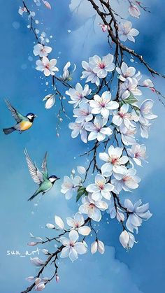 two birds are flying next to some white flowers on a tree branch with blue sky in the background