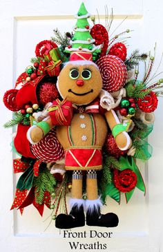 a christmas wreath with a gingerbread man on it