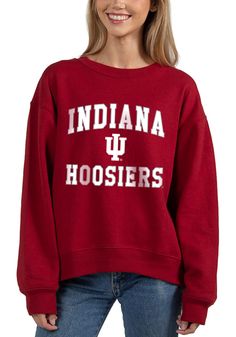 Make your way to the big game in this Indiana HoosiersWomens Crimson Old School Crew Sweatshirt! This Hoosiers Long Sleeve Sweatshirt features a screen print team name and logo on center chest. Stay warm and comfortable with this Womens Indiana Hoosiers Crew Sweatshirt. Long sleeve, Crew neck, Finished hem, High low bottom hem, 60% COTTON / 40% POLYESTER, 4 Collegiate Fall Top For Campus, Collegiate Spring Tops With Ribbed Cuffs, Spring Collegiate Tops With Ribbed Cuffs, Collegiate Style Top With Ribbed Cuffs For Spring, University Red Sweatshirt For College In Fall, University Red Varsity Top For Fall, University Red Tops For Fall, Collegiate University Red Tops For Fall, University Red Collegiate Top For Fall