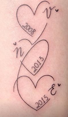 two hearts with the date 2013 and 2013 written on them in cursive writing