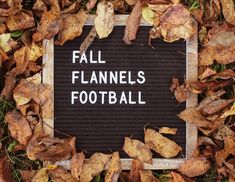 a sign that says fall flannels football surrounded by leaves and fallen down on the ground