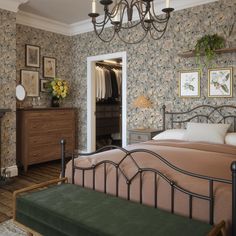 a bedroom with floral wallpaper and a bed in the middle, dressers on either side