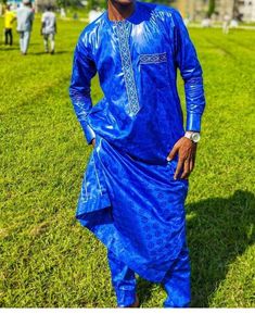 Bazin Mens africa wear is a handmade product . Luxury wear for any outings. Traditional marriage, birthday party or any occasion is lovely for this attire.  MADE TO ORDER > ensure you provide your real measurements. And  we will custom make it to fit your body. NB: when ordering your bazin the pattern might vary to the model but it is thesame colour due to market demand. Kindly ask before placing your order.  My standard measurement chart is listed below Xs Neck: 13-13.5 Chest: 33-34 Sleeve: 31.5-32 Waist: 27-28 S Neck: 14-14.5 Chest: 35-37 Sleeve: 32.5-33 Waist: 29-31 M Neck: 15-15.5 Chest: 38-40 Sleeve: 33.5-34 Waist: 32-34  L Neck: 16-16.5 Chest: 42-44 Sleeve: 34.5-35 Waist: 36-38 XL Neck: 17-17.5 Chest: 46-48 Sleeve: 35.5-36 Waist: 40-42 XXL Neck: 18-18.5 Chest: 5-52 Sleeve: 36-36.5 Wa Traditional Agbada In Ankara Fabric, Festive Fitted Traditional Agbada, Blue Traditional Agbada For Party, Festive Long Sleeve Agbada For Party, Traditional Festive Agbada For Party, Festive Traditional Agbada For Parties, Traditional Fitted Thobe For Party, Fitted Traditional Ankara Fabric Agbada, Traditional Fitted Agbada For Party