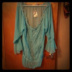 Shirt or beach cover up. Light blue ruffle ,lace and sequence cover up. Sheer material never worn Newport News Tops Blouses Light Blue Long Sleeve Tops For Beach Season, Light Blue Summer Blouse For Vacation, Light Blue Blouse For Summer Vacation, Blue Beachwear Top As Beach Cover-up, Blue Beachwear Top For Beach Cover-up, Blue Beachwear Top For Cover-up, Light Blue Flowy Top For Vacation, Flowy Light Blue Top For Vacation, Blue Ruffled Beach Blouse