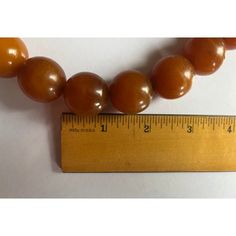 Large natural Baltic Amber worry beads strung on a fabric cord. Each round bead measures under 1" diameter. Strand includes 19 large beads and 3 small beads. Must be restrung on a longer cord if you wish to wear these beads as a necklace. Originally used as worry beads in the hand. Wonderful color and natural inclusions. Worry Beads, Large Beads, Small Beads, Amber Beads, Bead Stringing, Baltic Amber, Round Beads, No Worries, Amber