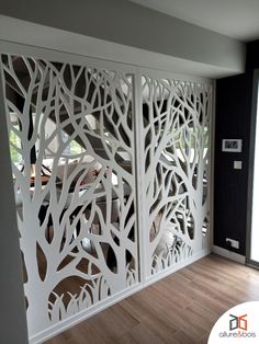 the room divider is made out of white wood