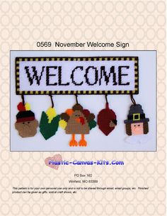 a welcome sign is hanging from the side of a wall with acorns on it