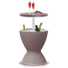 a table with two wine glasses on it and bottles in the bottom, sitting next to each other