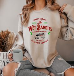 The Perfect Christmas Gift Sweater for fans of the Perfect Family Christmas Movie. The Wet Bandits Sweat Shirt from Home Alone is sure to put a smile on everyone's face and will make a perfect gift.  Ideal for any situation, a unisex heavy blend crewneck sweatshirt is pure comfort. These garments are made from polyester and cotton. This combination helps designs come out looking fresh and beautiful. The collar is ribbed knit, so it retains its shape even after washing. There are no itchy side se Wet Bandits, Home Alone Movie, Xmas Shirts, Tree Farm, Christmas Tree Farm, Gildan Sweatshirts, Home Alone, Tree Farms, Custom Tees