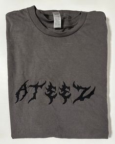 **PLEASE READ**  A fun heavy metal-based ATEEZ tee!  Please give me a week for making and processing as I have a full time job and work alone :)  This is made on a 100% heavy cotton Gildan t-shirt. Please wash in cold water and gentle dry. Metal T Shirt, Metal T Shirts, Full Time Job, Cool Sweaters, Full Time, Heavy Metal, Heavy Cotton, Cold Water, Gender Neutral