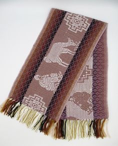 This beautiful Alpaca wool scarf is woven from Alpaca wool blend with llama and chakanas design. This scarf is originally made from local makers in Cusco - Peru. This beautiful scarf is a perfect cozy gift for your love one.  Features: * Made from Alpaca and acrylic yarn. Measurements:   62 inches (L) x 9.5 inches (W) Dry clean or hand wash gently in cold water with mild detergent - dry flat - no machine dryer Bohemian Alpaca Scarves For Winter, Bohemian Handwoven Alpaca Scarves, Alpaca Scarf, Cusco Peru, Cozy Gift, For Your Love, Design Web, Alpaca Wool, Wool Scarf