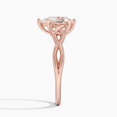 a rose gold engagement ring with an intricate design on the shan shan shan shan shan shan shan